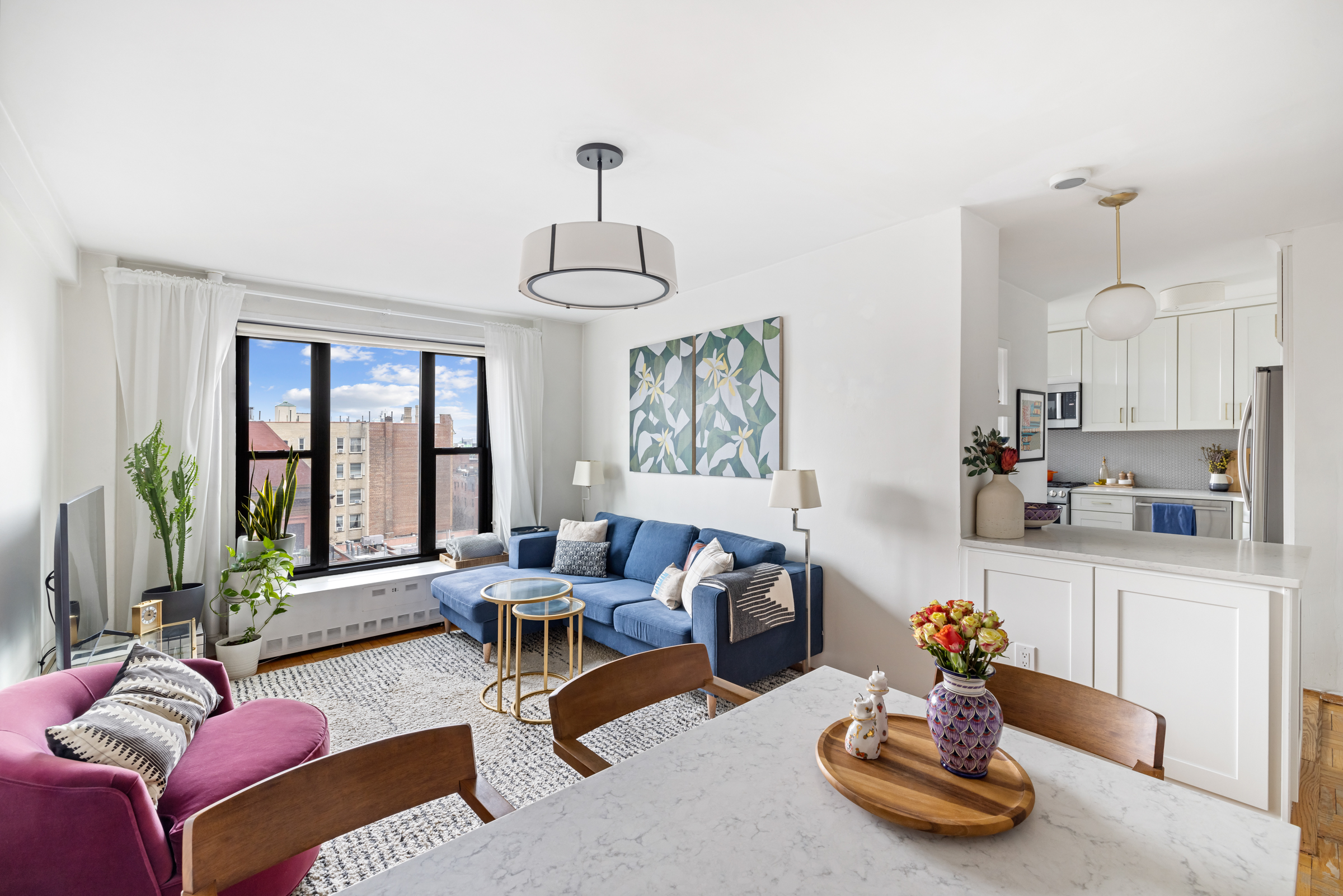 325 Clinton Avenue, Unit 7A Brooklyn, NY 11205 - Photo 1 of 13 a living room with furniture kitchen and a large window