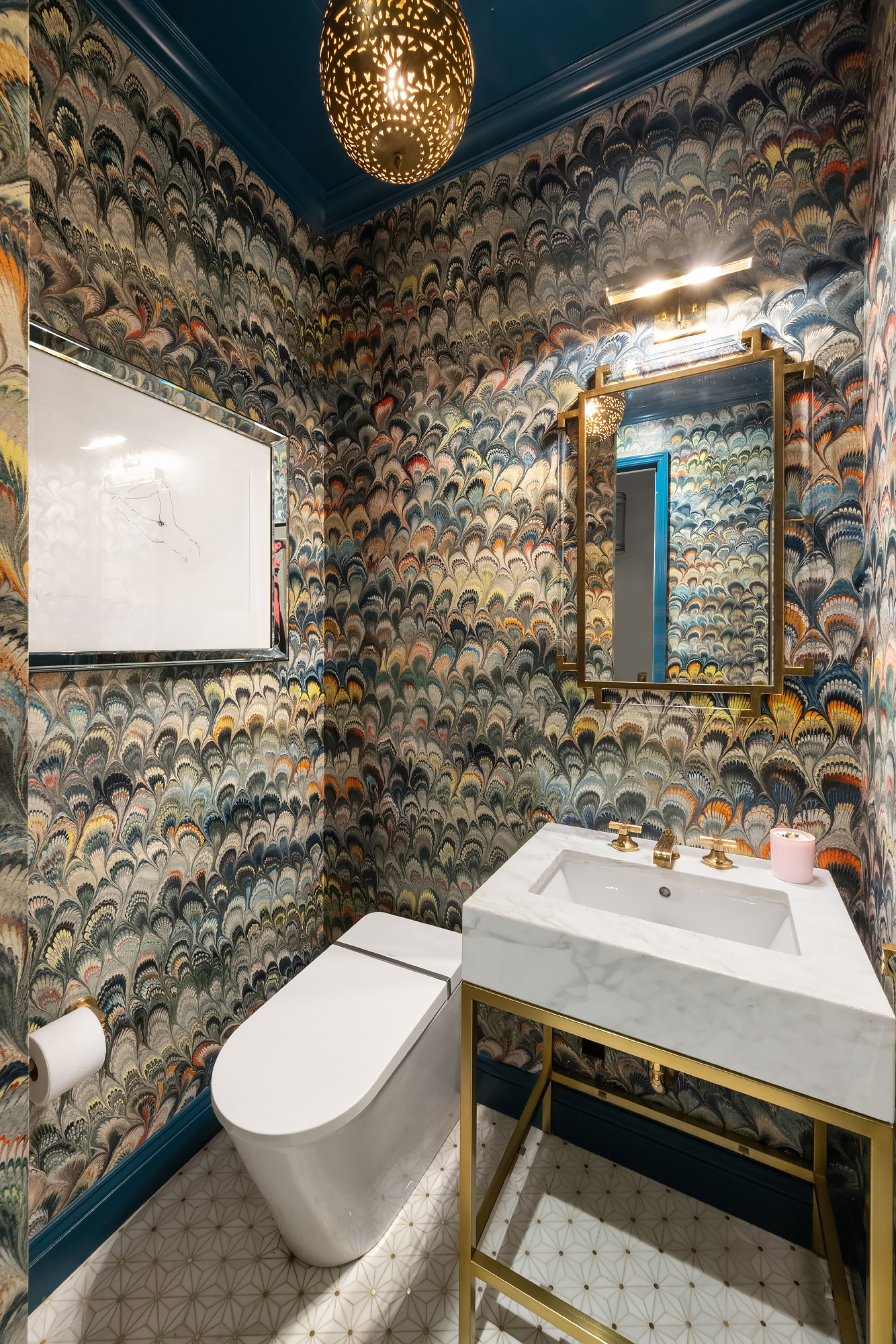 145 East 76th Street, Unit PH Manhattan, NY 10021 - Photo 16 of 19 a bathroom with a sink toilet and mirror