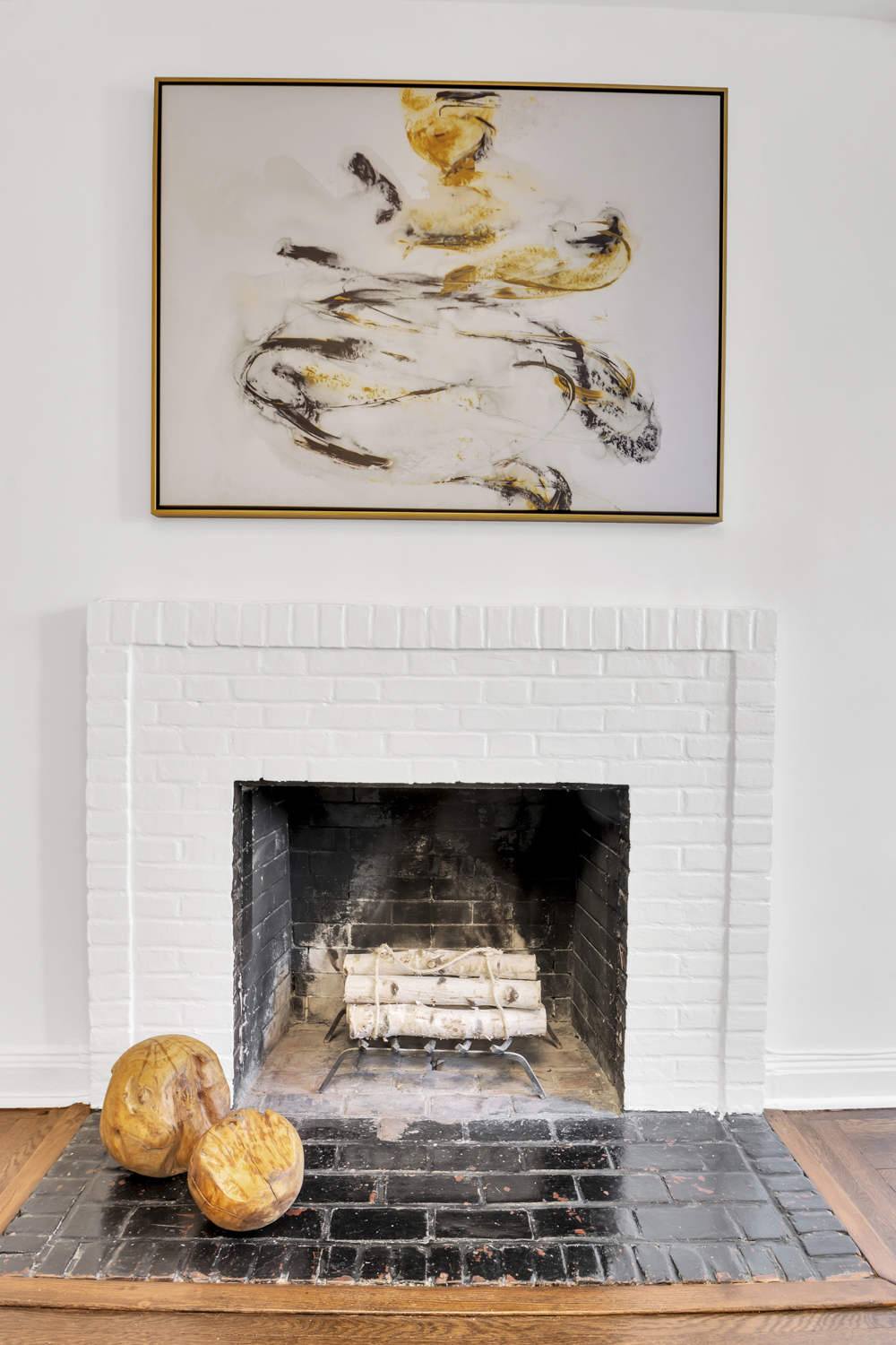 59 West 12th Street, Unit 6A Manhattan, NY 10011 - Photo 5 of 11 a living room with a fireplace and a wooden floor