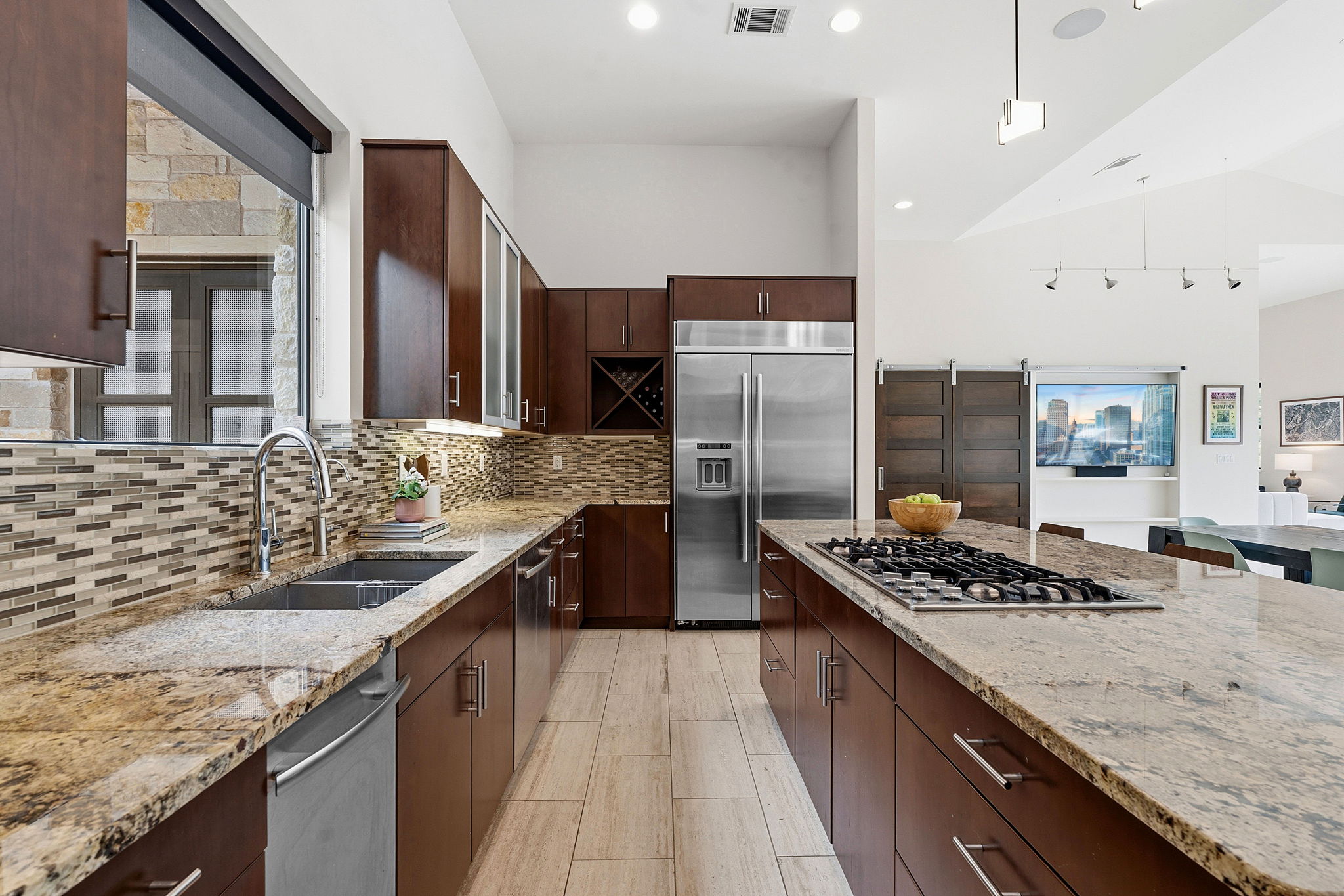 3605 Robbins Road Austin, TX 78730 - Photo 17 of 51 a kitchen with stainless steel appliances granite countertop a sink stove and refrigerator