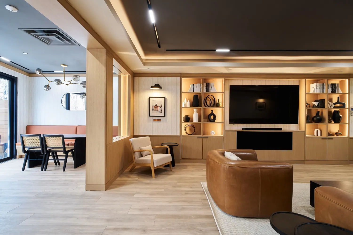 a view of a dining room with a table and chairs