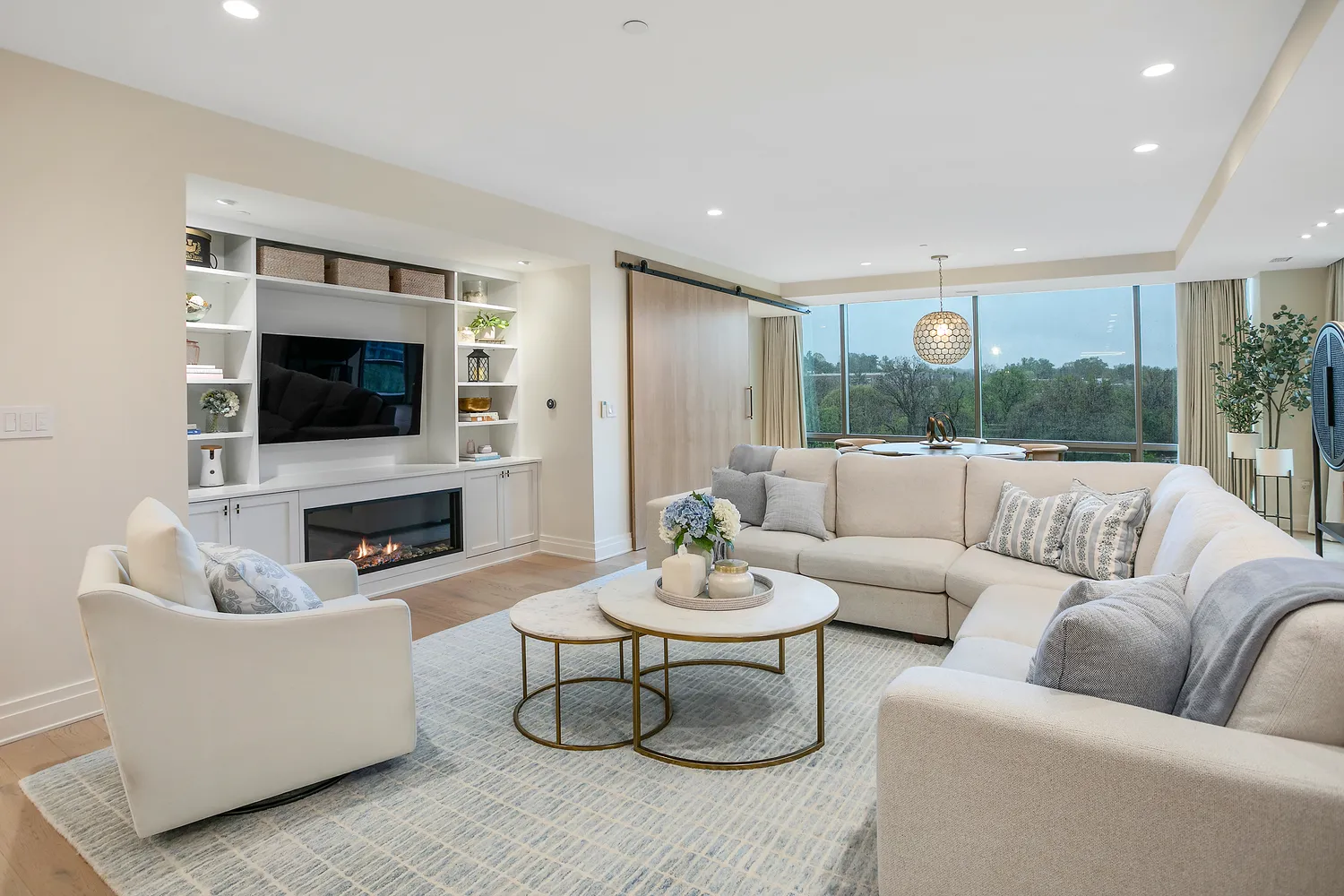 a living room with fireplace furniture and a flat screen tv