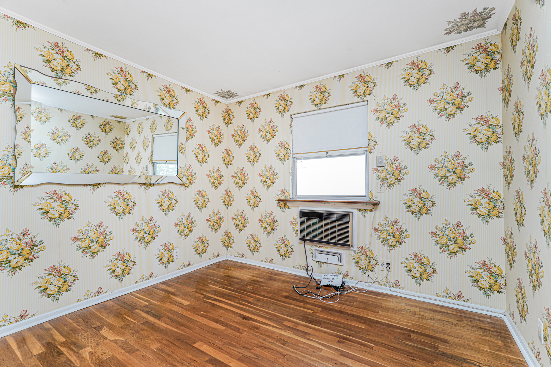 461 Mayfair Drive South Brooklyn, NY 11234 - Photo 14 of 30 a view of a livingroom with wooden floor and a window