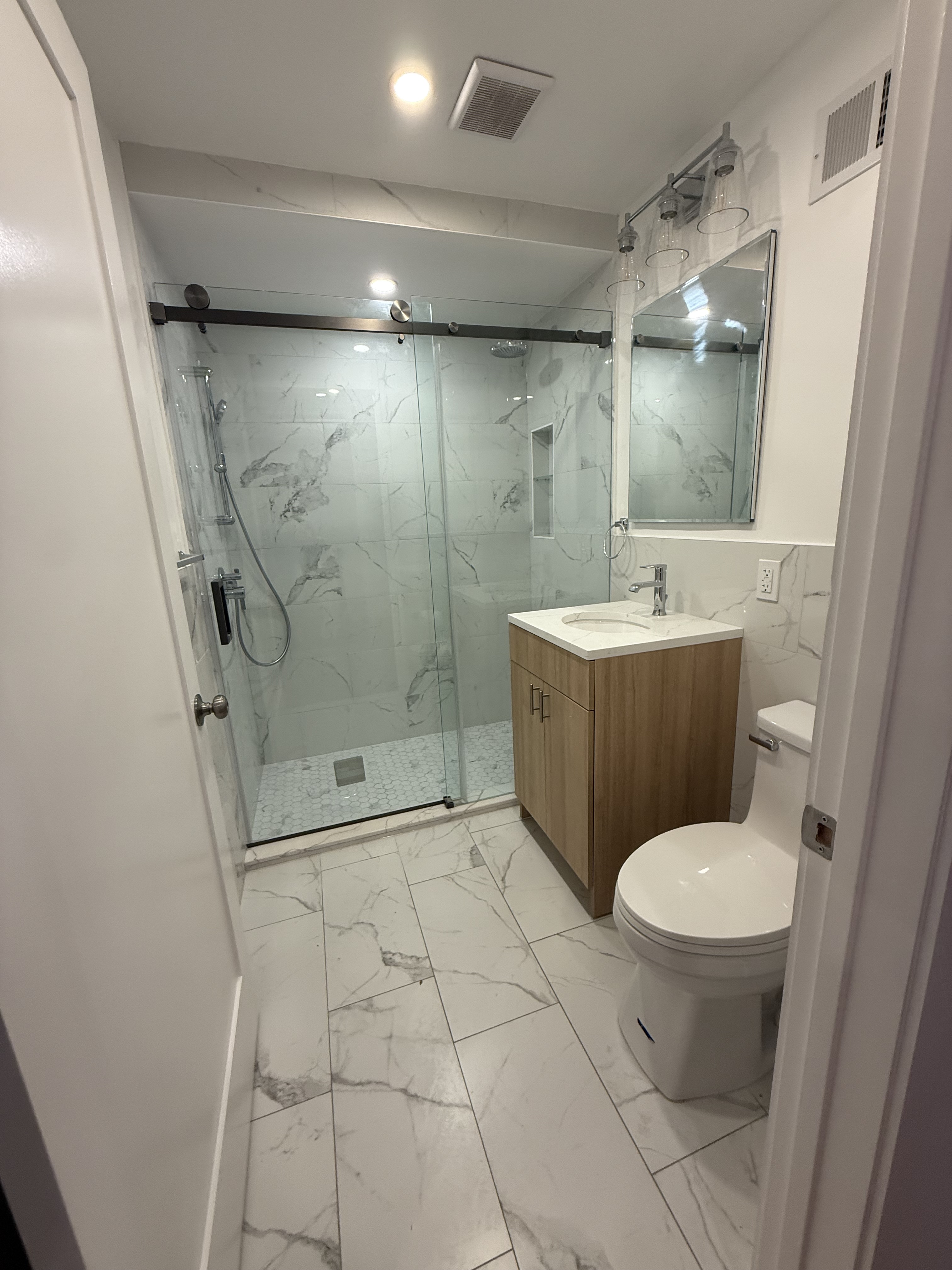 109 President Street, Unit 1 Brooklyn, NY 11231 - Photo 9 of 16 a bathroom with a sink toilet and shower