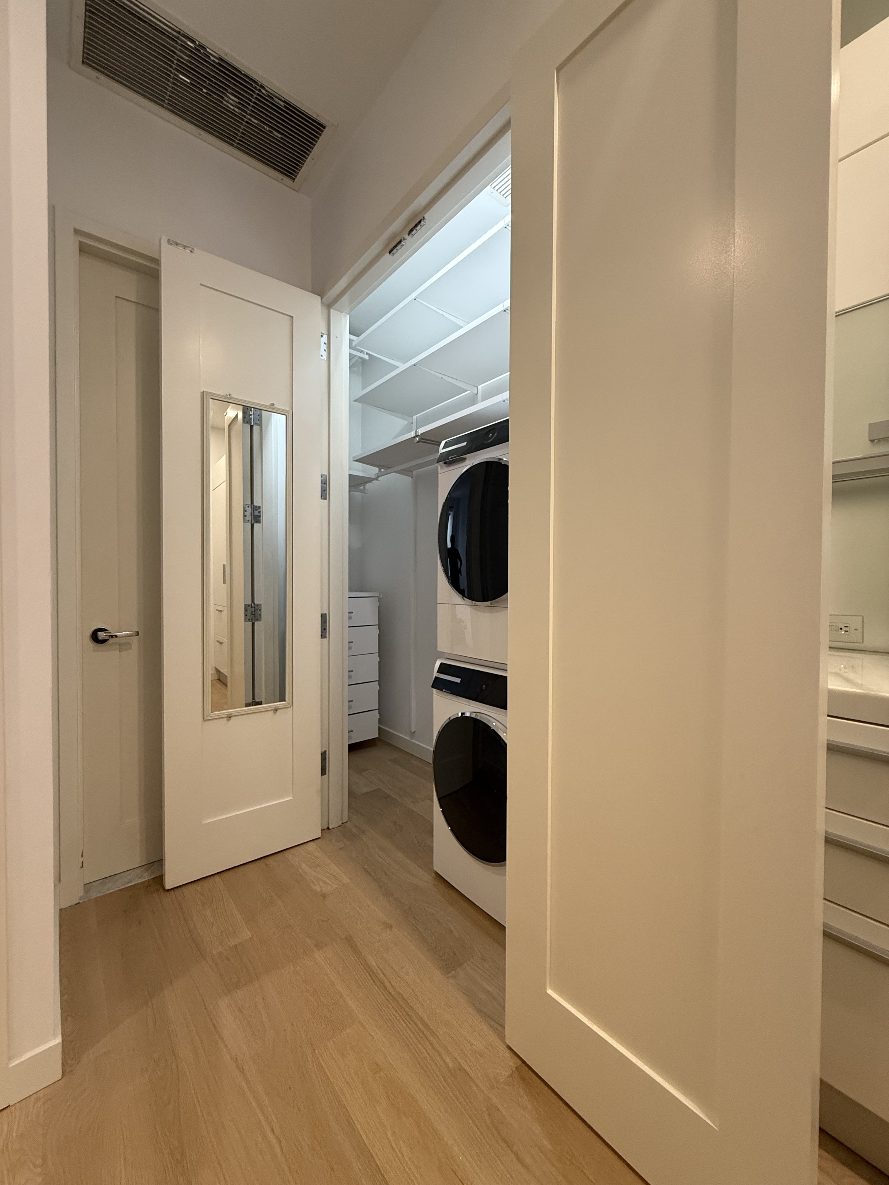 11 East 36th Street, Unit 503 Manhattan, NY 10016 - Photo 14 of 17 a view of a utility room with washer and dryer