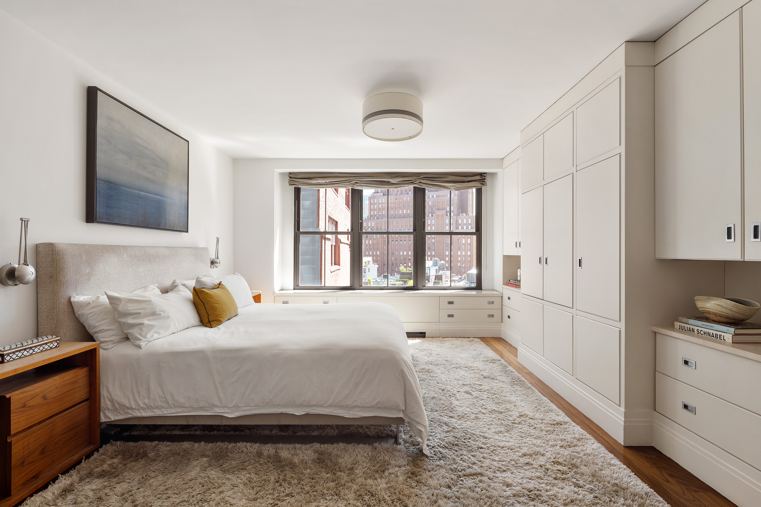 27 North Moore Street, Unit 10D Manhattan, NY 10013 - Photo 17 of 30 a bedroom with a bed and a window