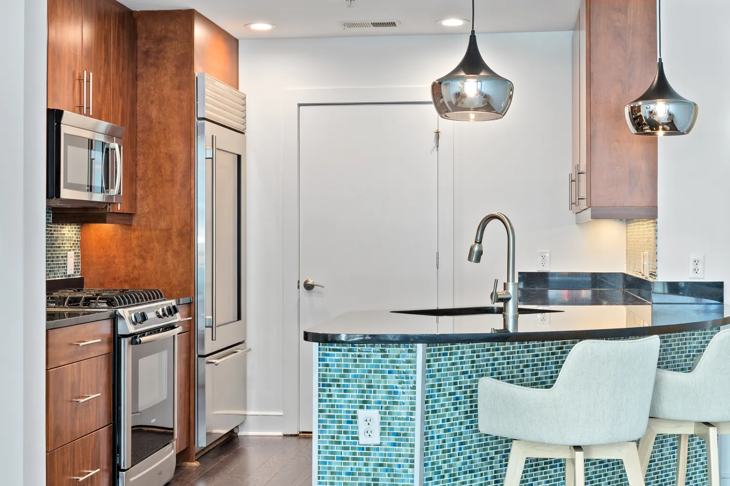 a bathroom with a sink a mirror and a shower