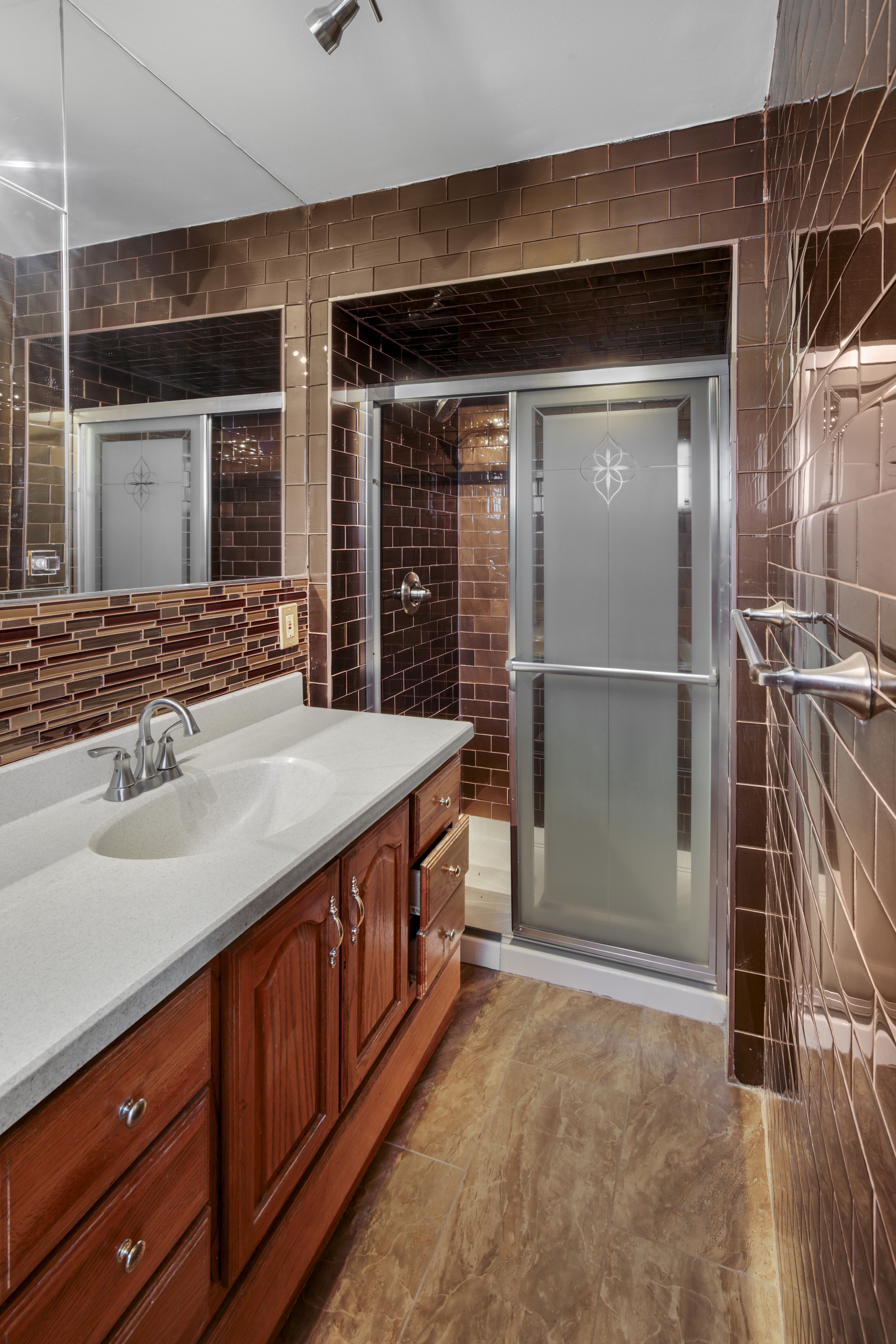 60 82nd Street Brooklyn, NY 11209 - Photo 13 of 19 a spacious bathroom with a granite countertop sink and a mirror