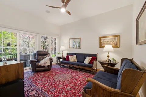 a living room with furniture rug and window