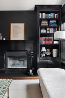 a kitchen view with fireplace and window