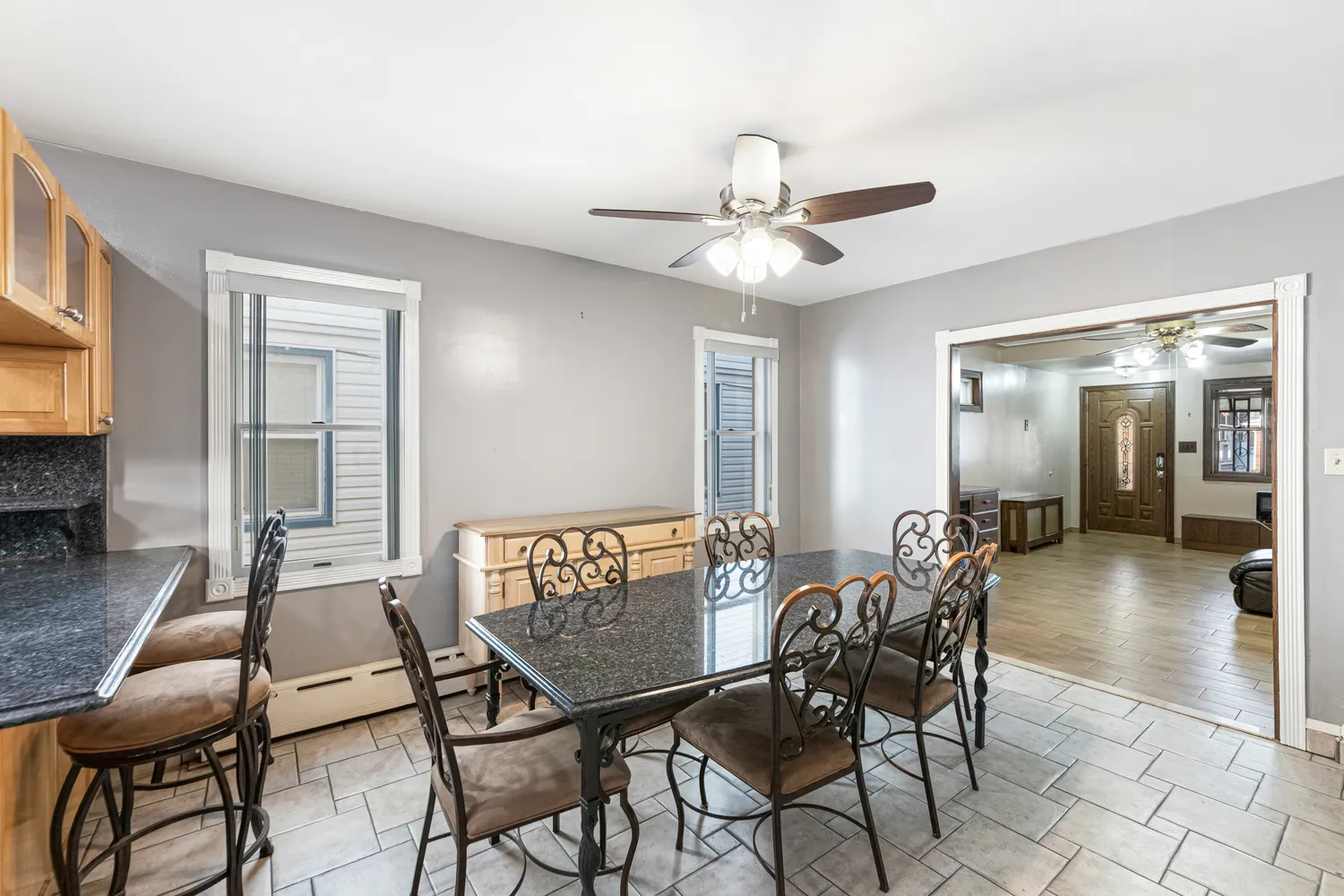 a view of a dining room with furniture and chandelier