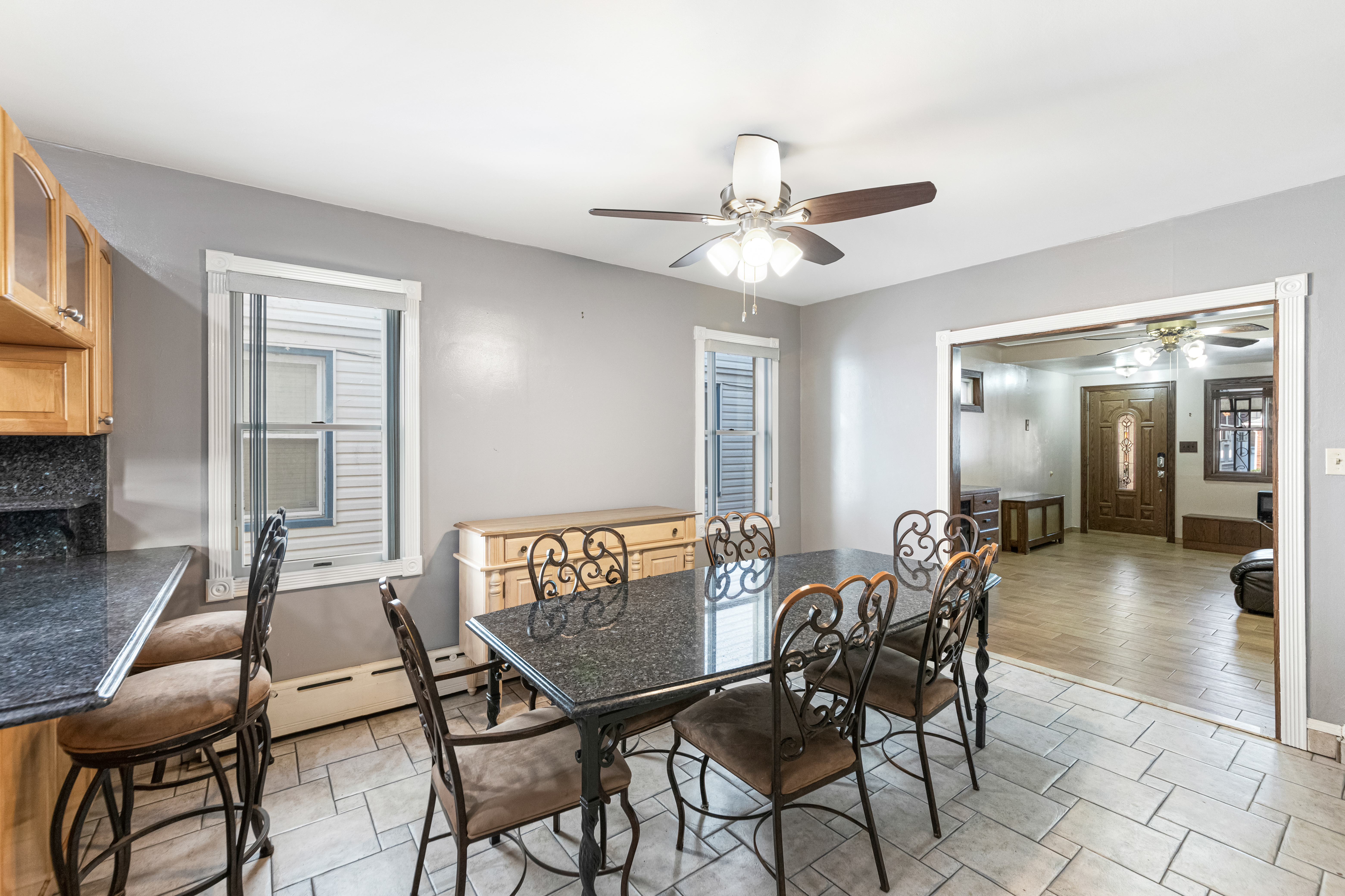 1874 Ryder Street Brooklyn, NY 11234 - Photo 8 of 20 a view of a dining room with furniture and chandelier