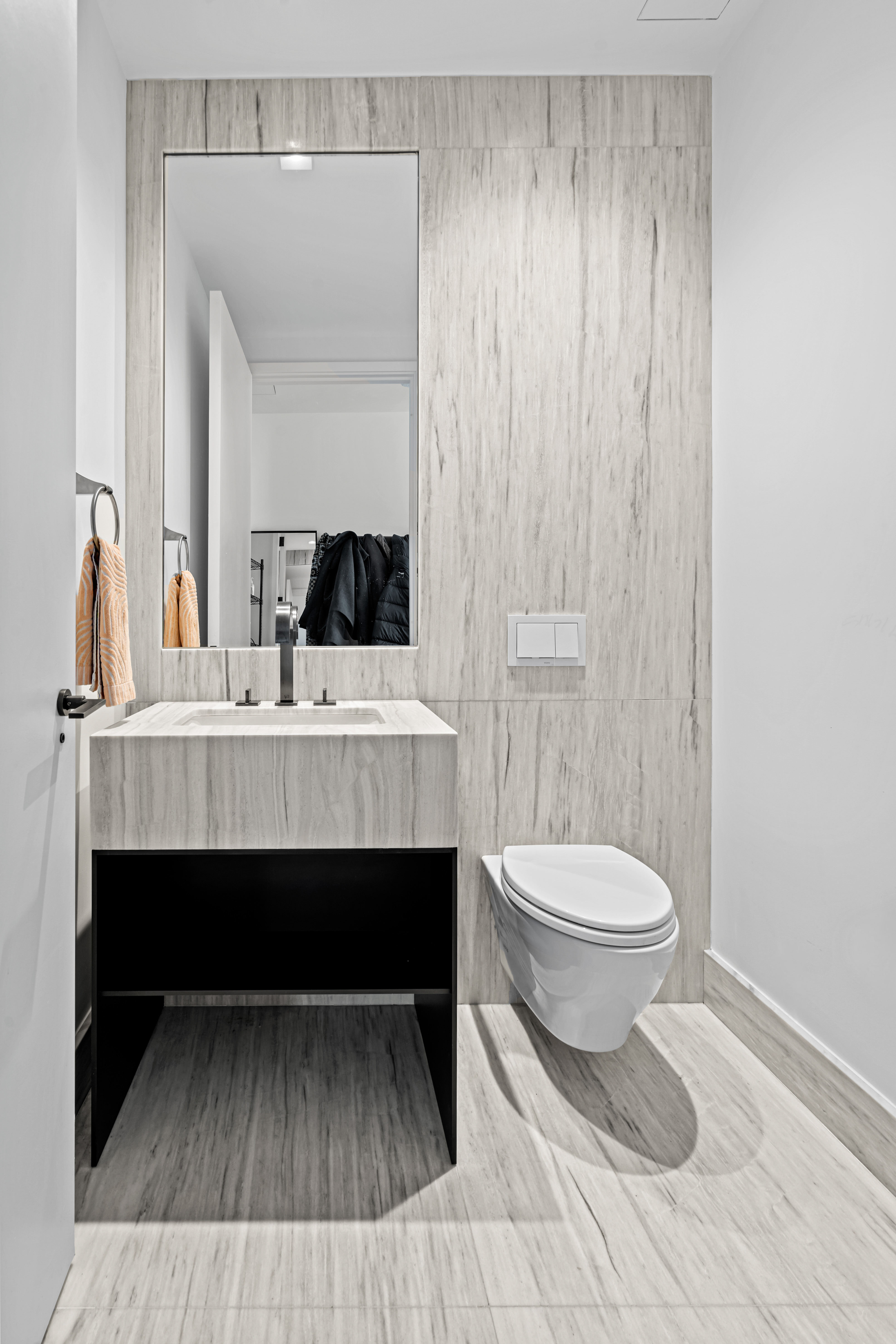 111 Murray Street, Unit 43B Manhattan, NY 10007 - Photo 13 of 17 a bathroom with a sink a toilet and a mirror