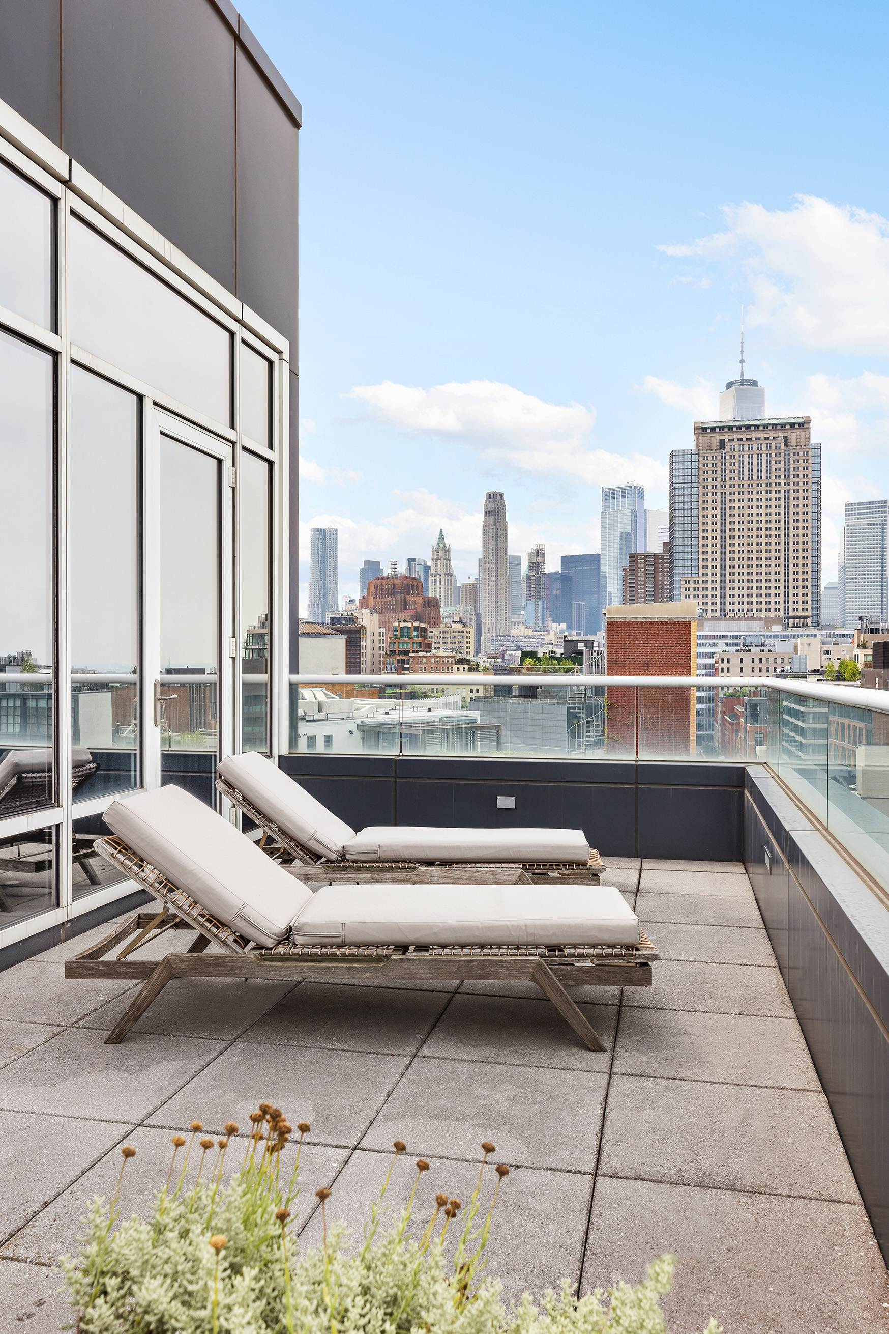 330 Spring Street, Unit PH Manhattan, NY 10013 - Photo 19 of 23 a living room with furniture and a floor to ceiling window