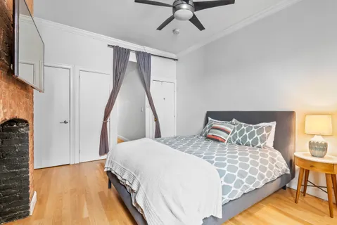 a bed room with a bed and a couch