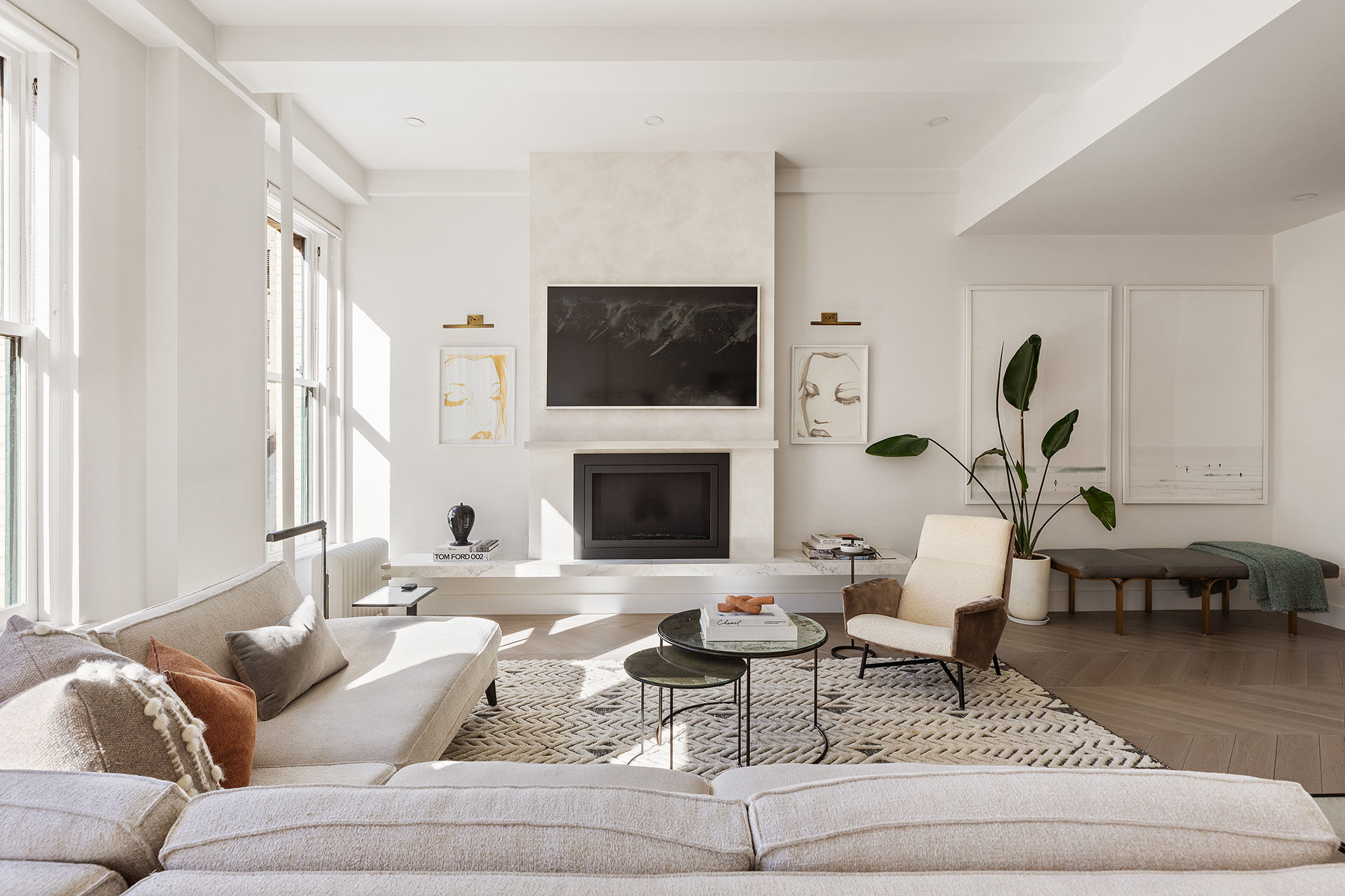 100 Hudson Street, Unit 7BC Manhattan, NY 10013 - Photo 4 of 20 a living room with furniture a flat screen tv and a fireplace
