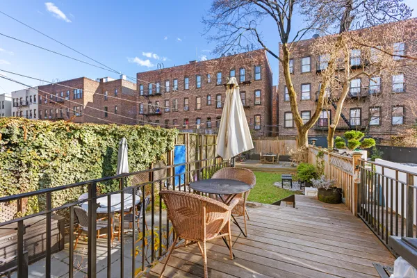 a view of a chairs and table in the patio
