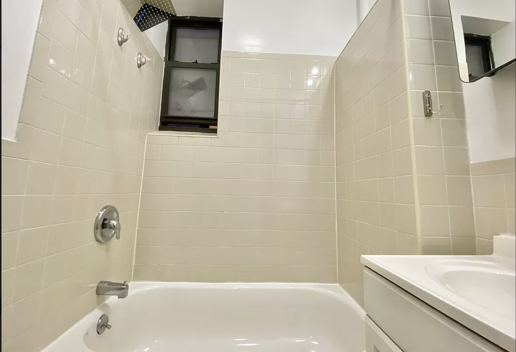 314 East 11th Street, Unit 3B Manhattan, NY 10003 - Photo 10 of 11 a bathroom with a sink and a bathtub