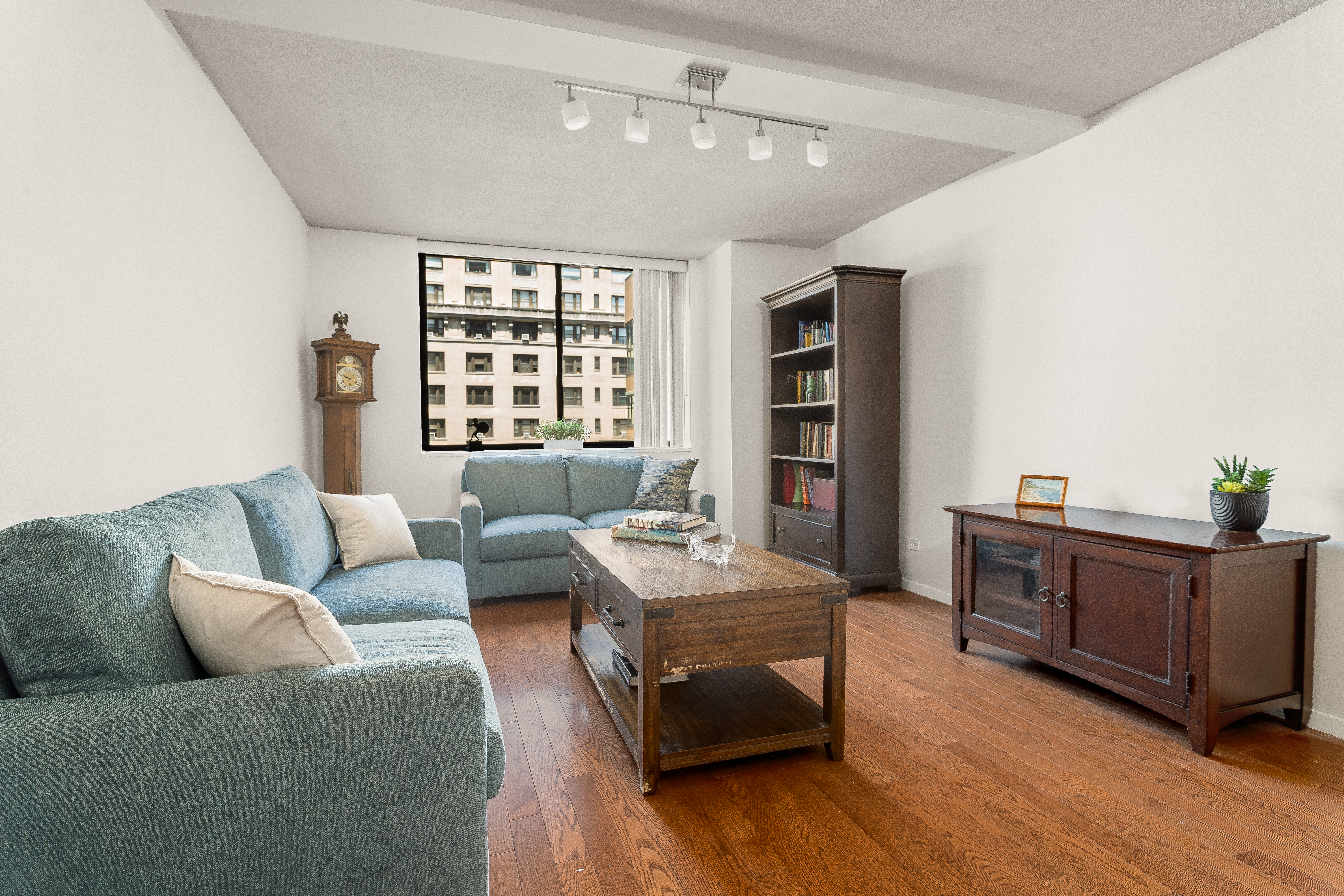 275 West 96th Street, Unit 12B Manhattan, NY 10025 - Photo 2 of 28 a living room with furniture and window
