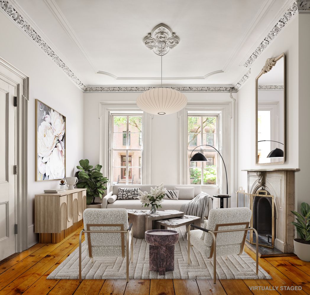 a living room with fireplace furniture and a window