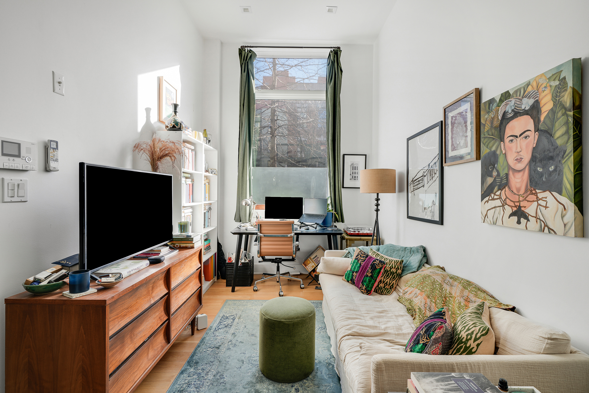 622 Grand Avenue, Unit 102 Brooklyn, NY 11238 - Photo 5 of 13 a living room with furniture and a flat screen tv