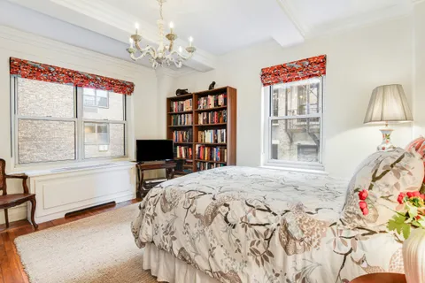 a bedroom with a bed furniture and a window