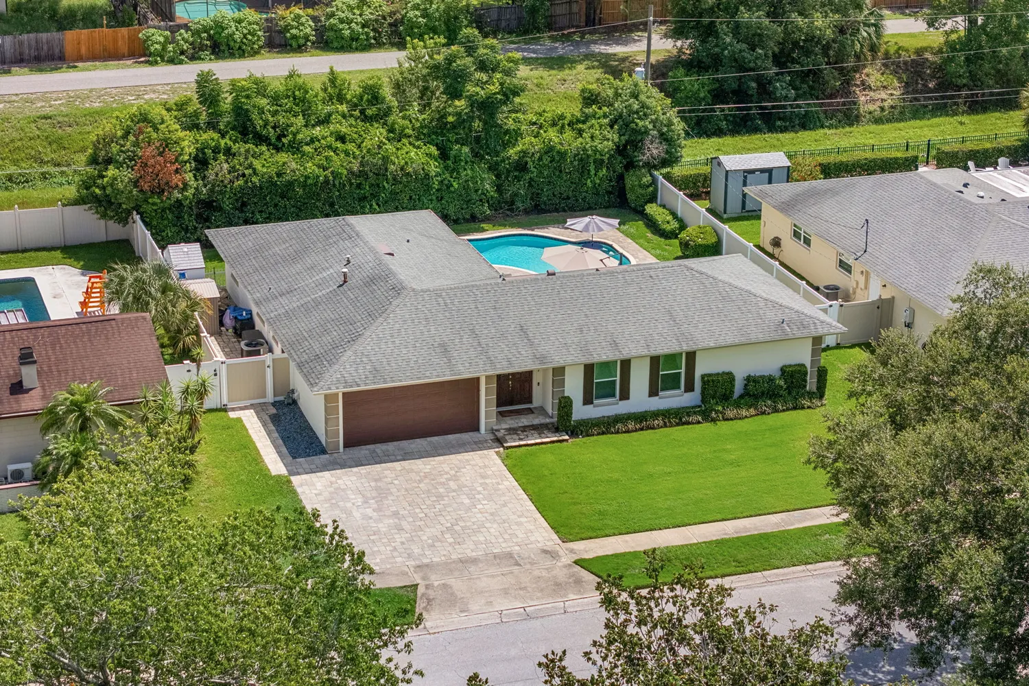 a aerial view of a house with a yard