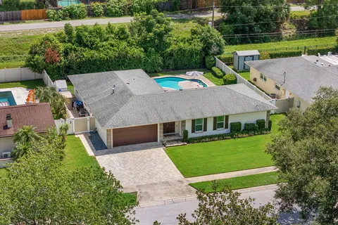 a aerial view of a house with a yard