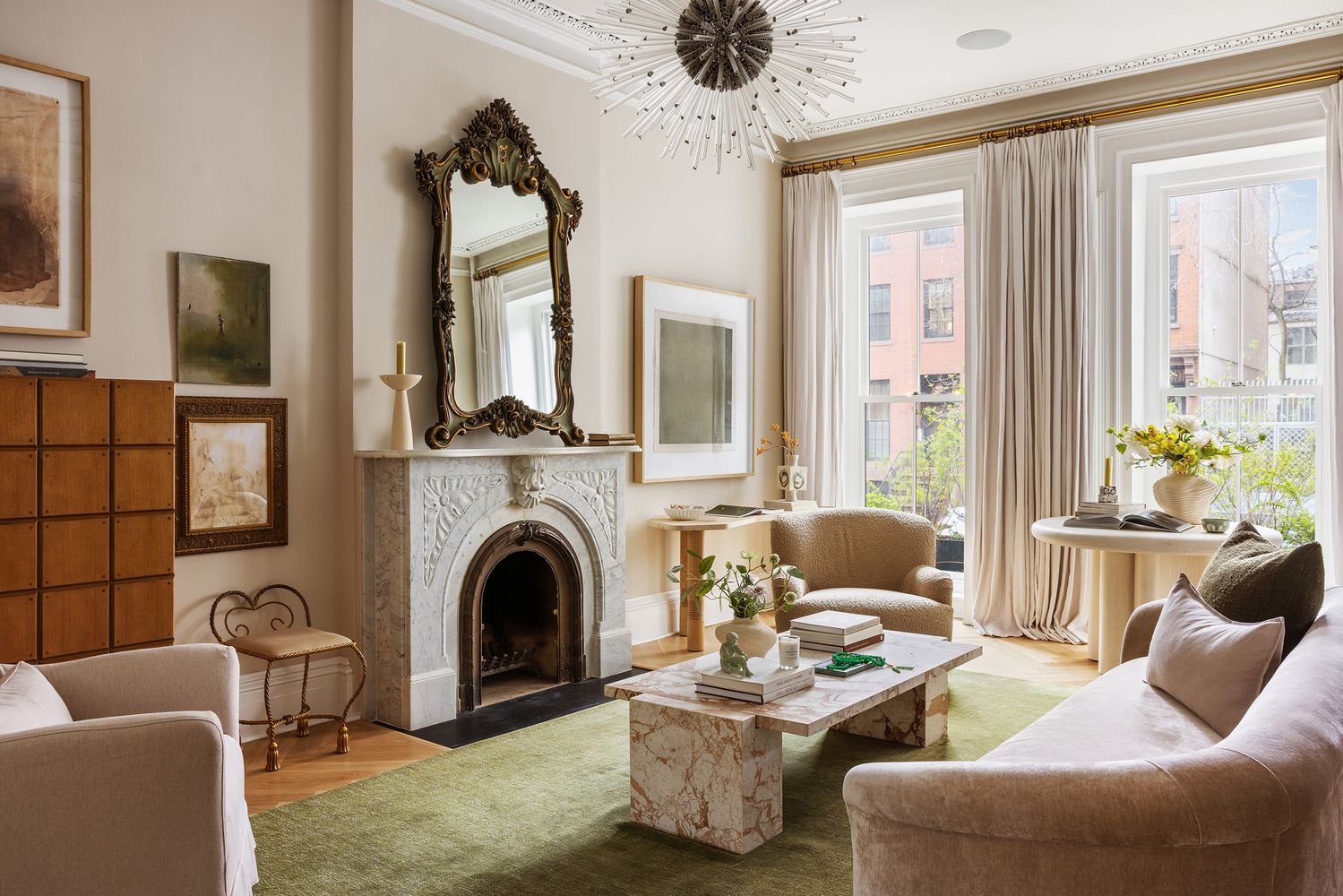 a living room with furniture large window and a fireplace