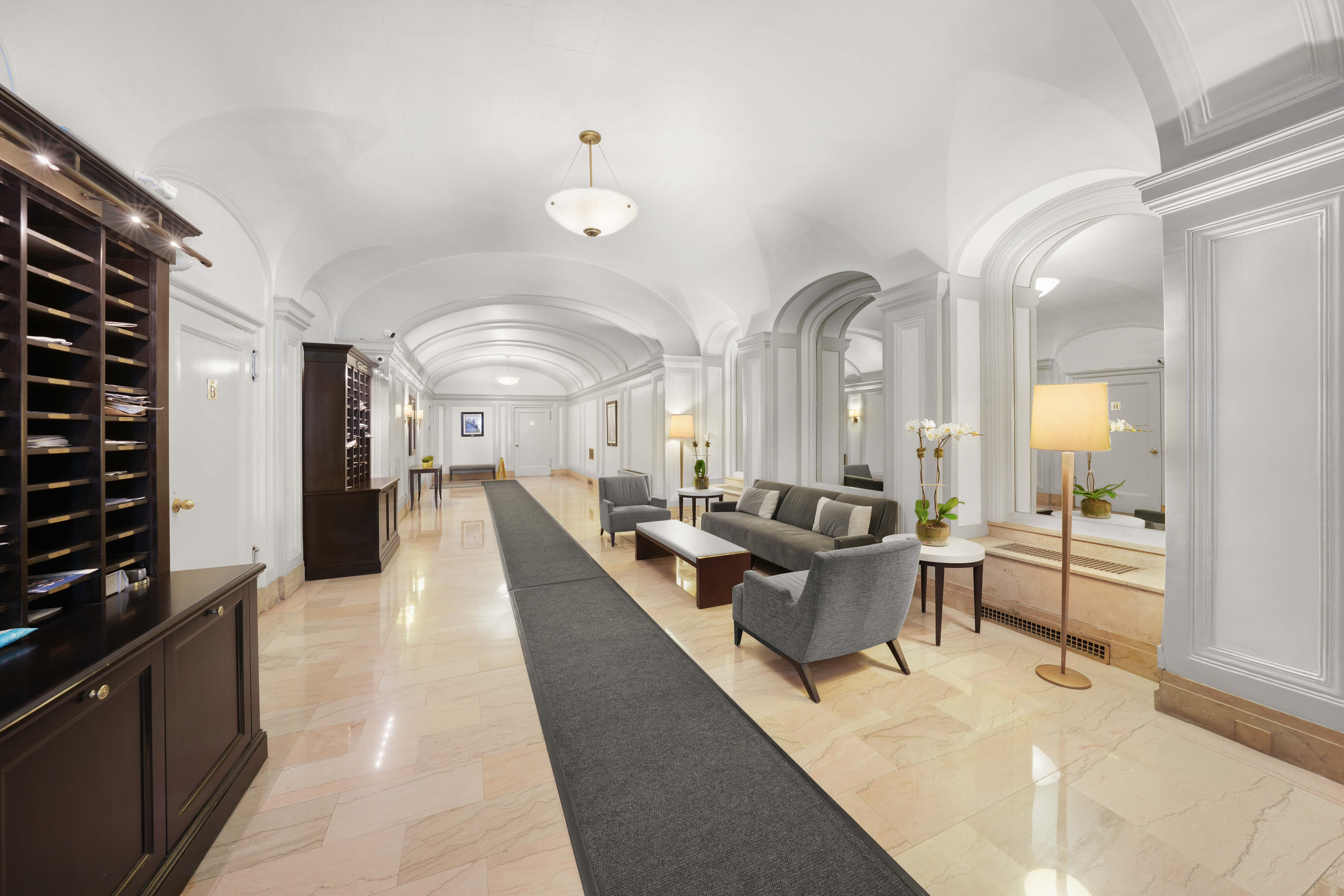 176 West 87th Street, Unit 1H Manhattan, NY 10024 - Photo 17 of 19 a large living room with stainless steel appliances kitchen view and a counter top space