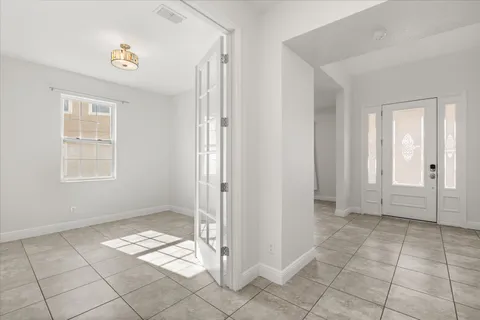 a bathroom with a shower sink and mirror