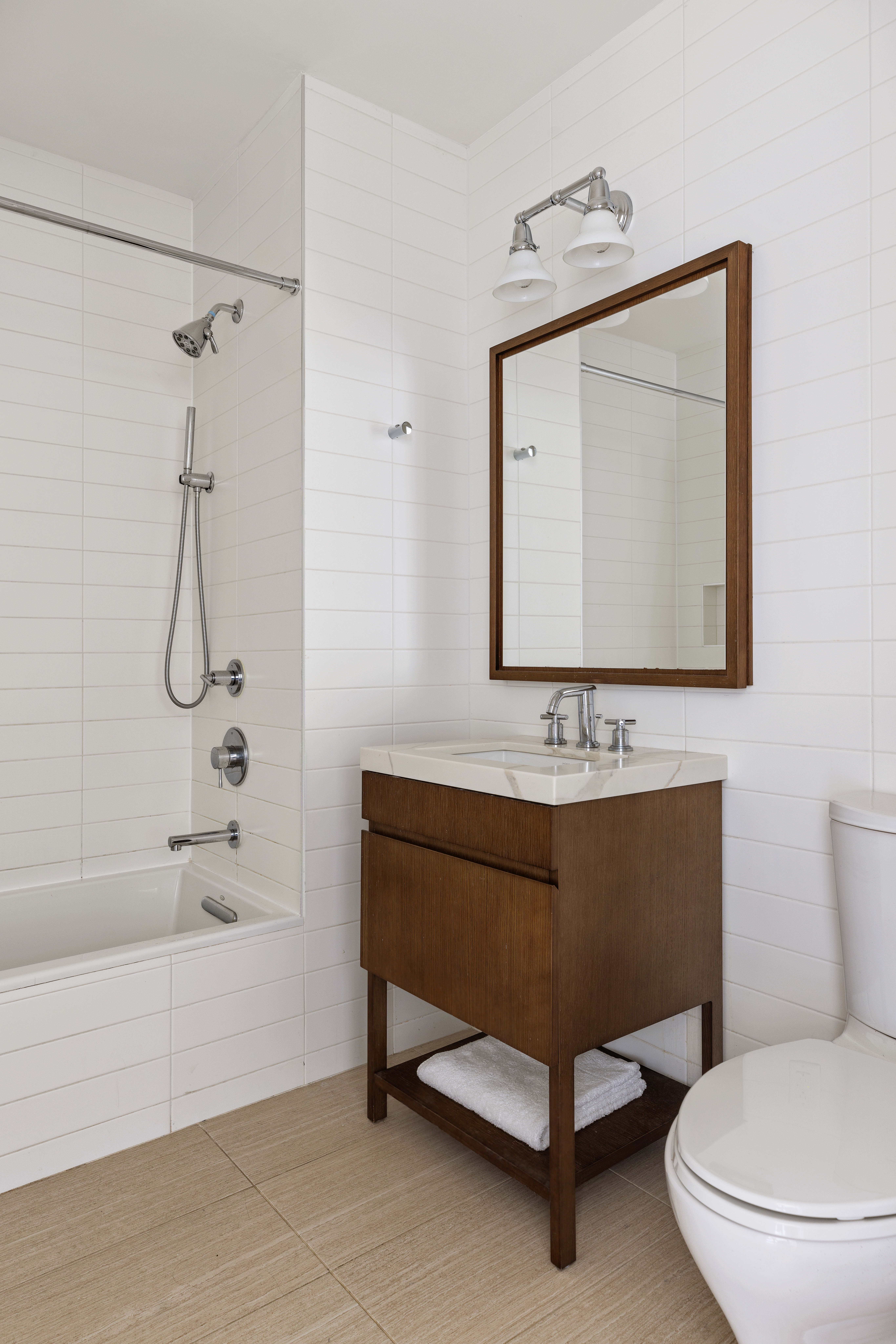 500 Waverly Avenue, Unit PH5 Brooklyn, NY 11238 - Photo 9 of 12 a bathroom with a sink a toilet and a bathtub