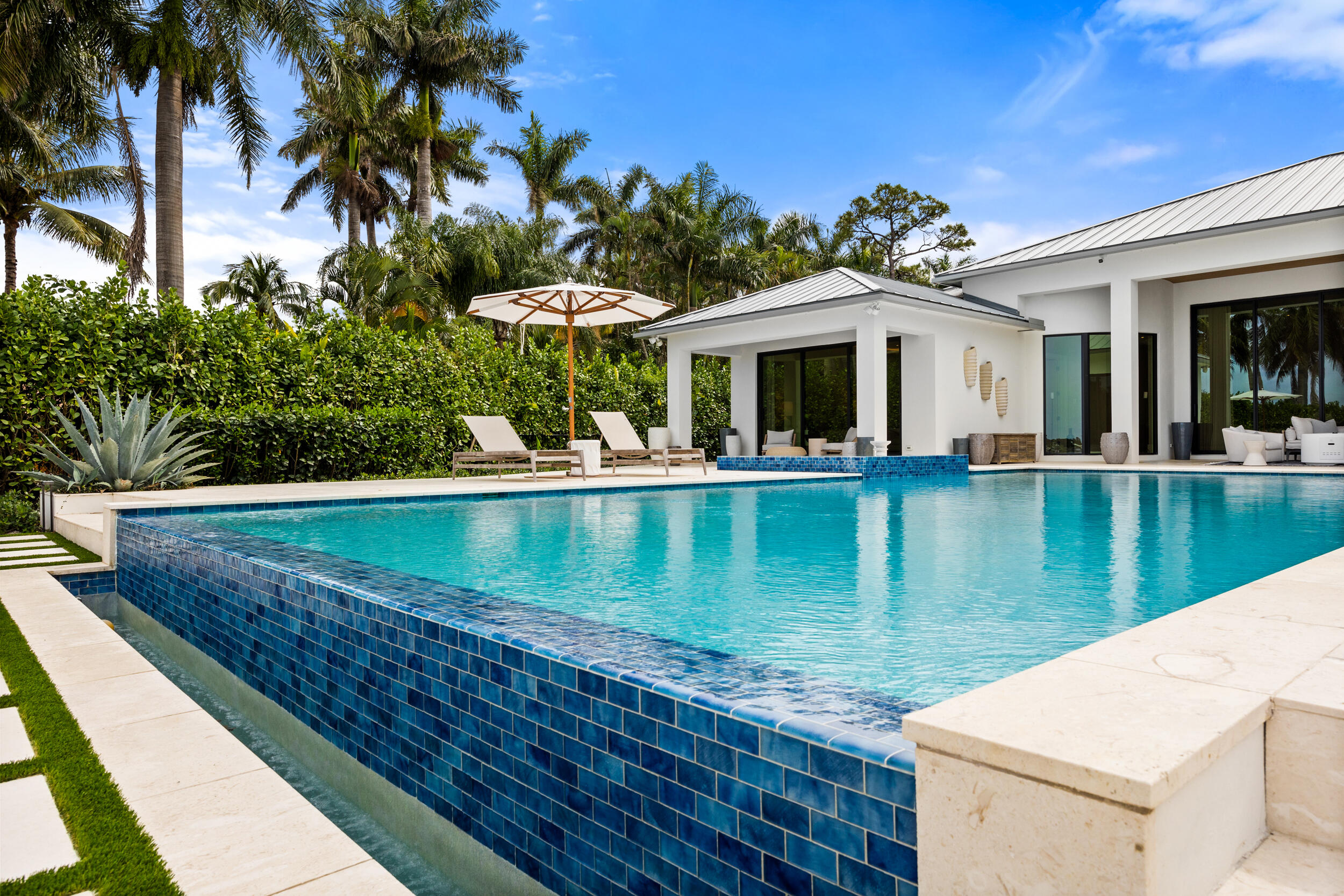 5695 Pennock Point Road Jupiter, FL 33458 - Photo 16 of 77 a view of a house with a yard