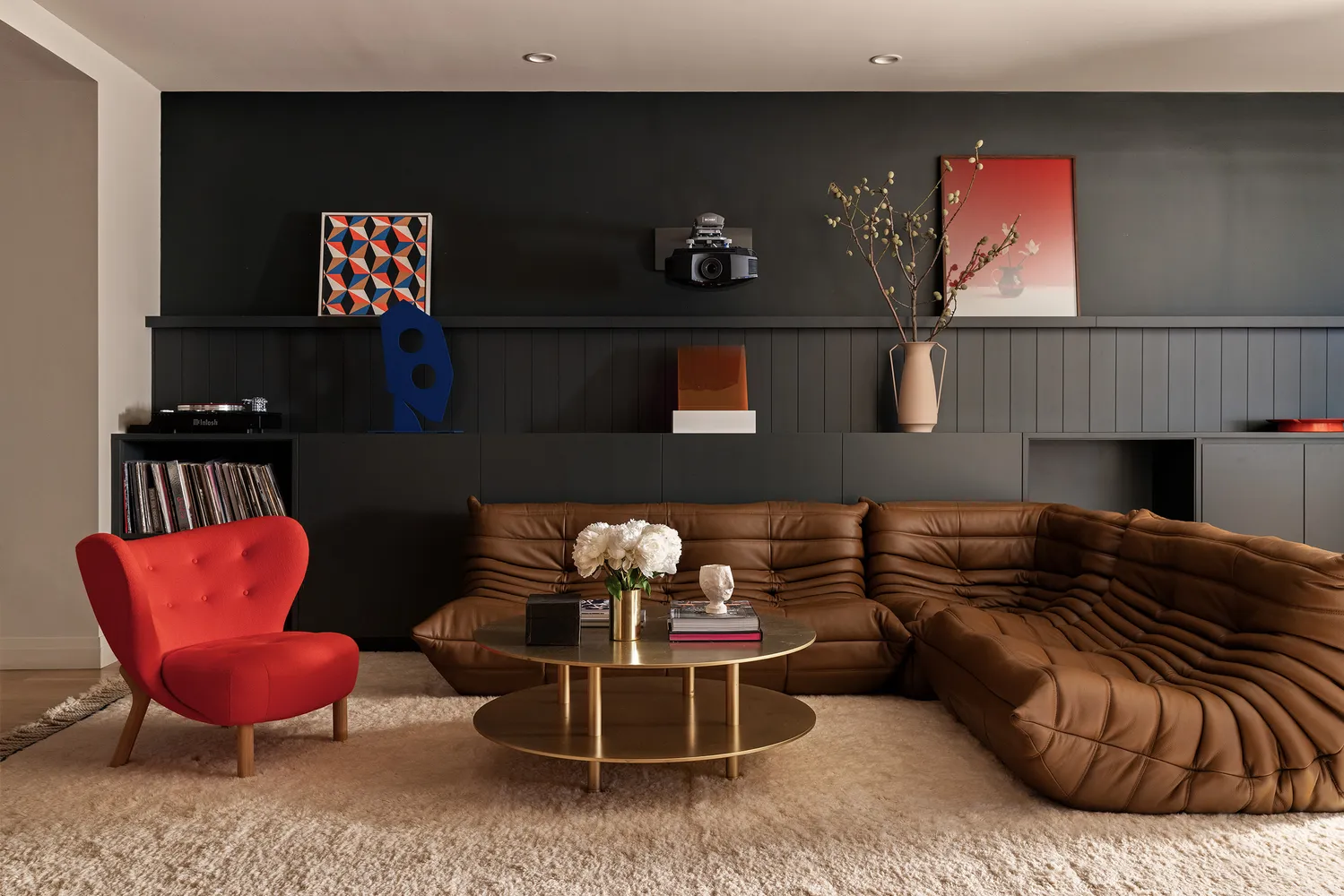 a kitchen with a refrigerator and a chair
