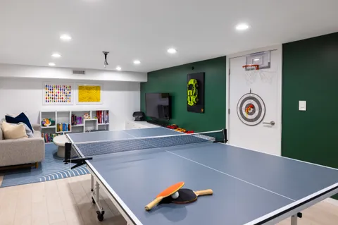 a room with furniture and air hockey table