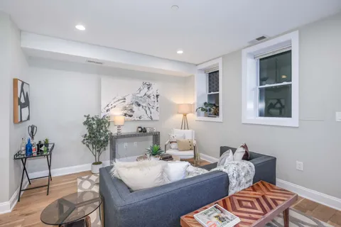 a living room with furniture and window