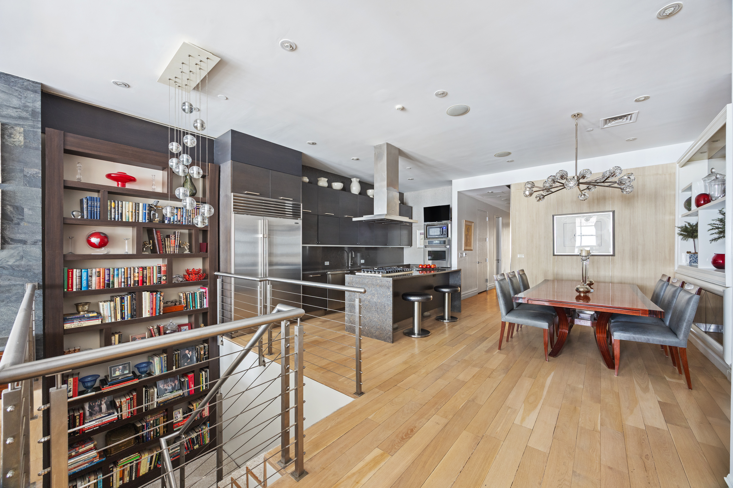 157 East 84th Street, Unit THA Manhattan, NY 10028 - Photo 15 of 33 a living room with lots of furniture and a wooden floor