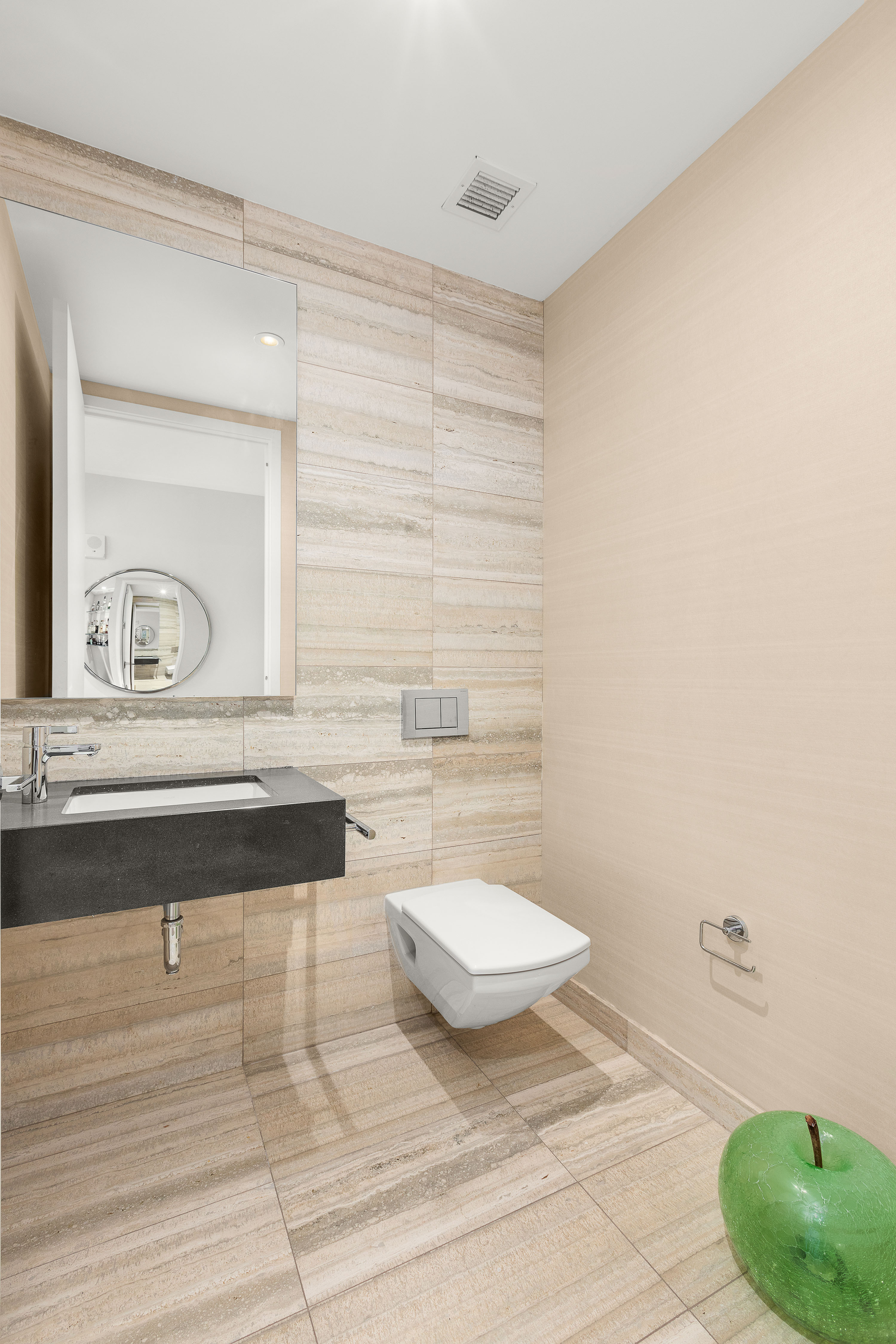 50 West Street, Unit 14B Manhattan, NY 10006 - Photo 13 of 29 a bathroom with a sink a toilet and a mirror