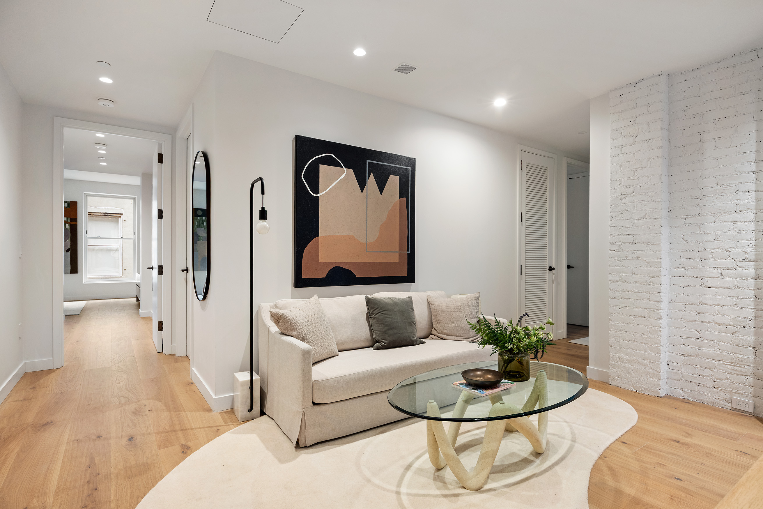 62 Reade Street, Unit 4 Manhattan, NY 10007 - Photo 9 of 20 a living room with furniture and a potted plant