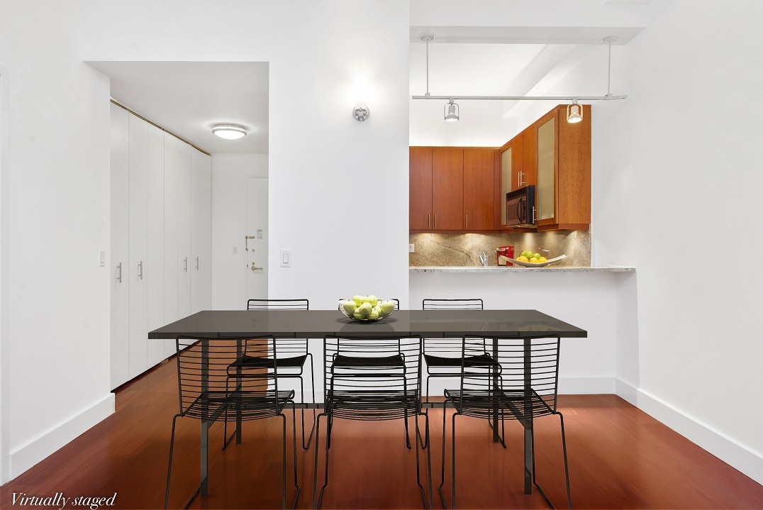 80 John Street, Unit 5G Manhattan, NY 10038 - Photo 3 of 8 a dining room with furniture and wooden floor