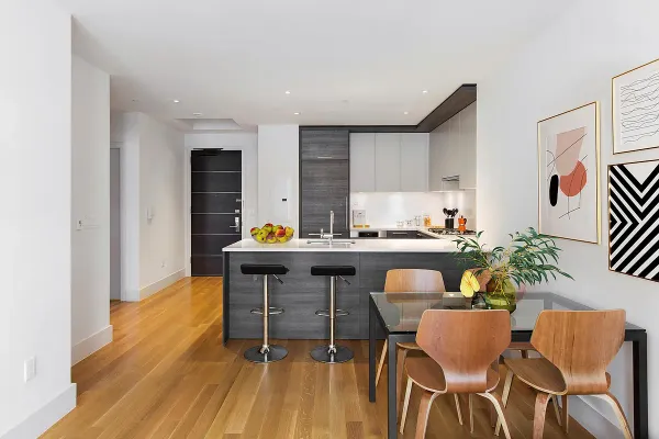 a kitchen with a table and chairs in it