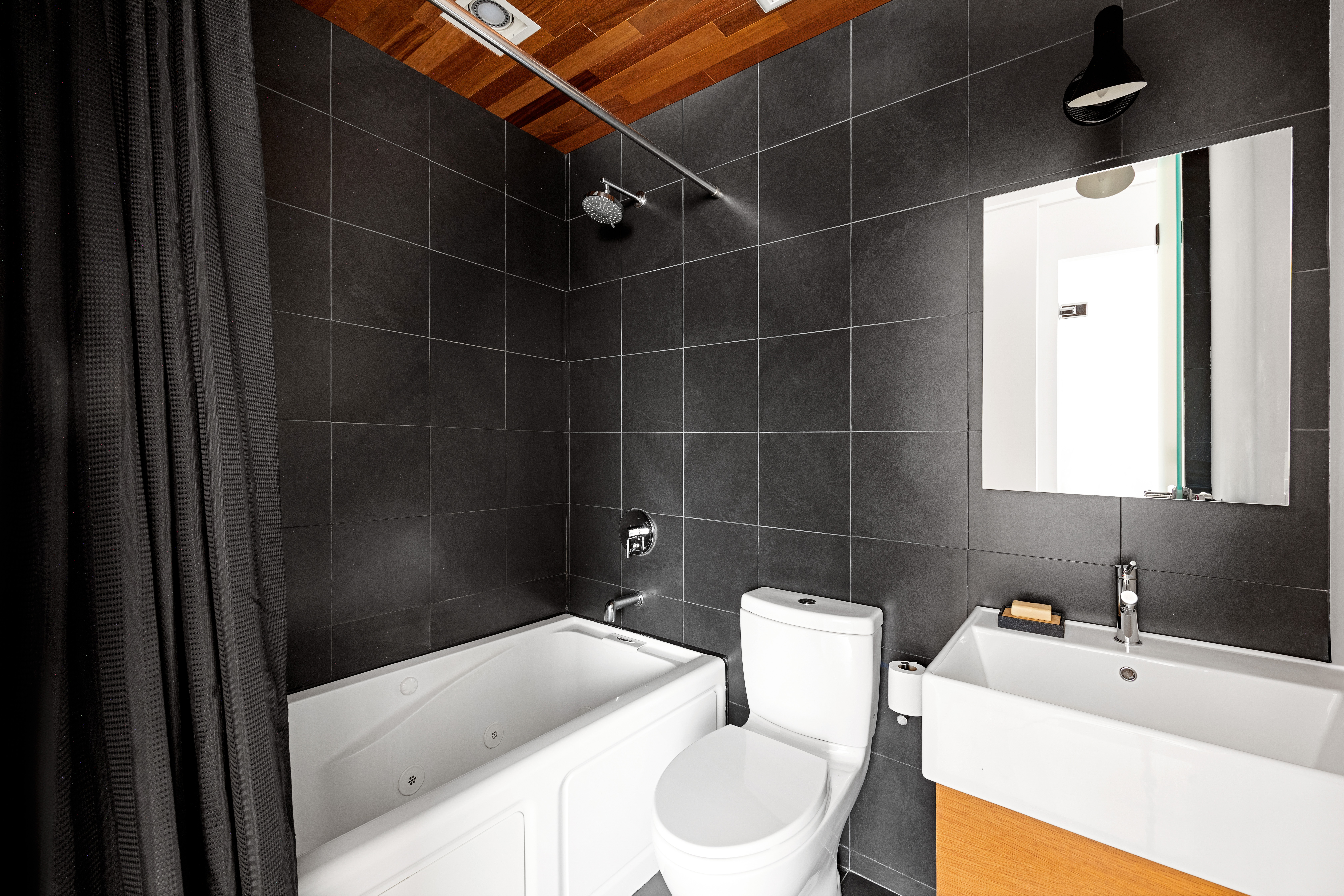 481 18th Street, Unit PH Brooklyn, NY 11215 - Photo 7 of 11 a bathroom with a sink toilet and shower