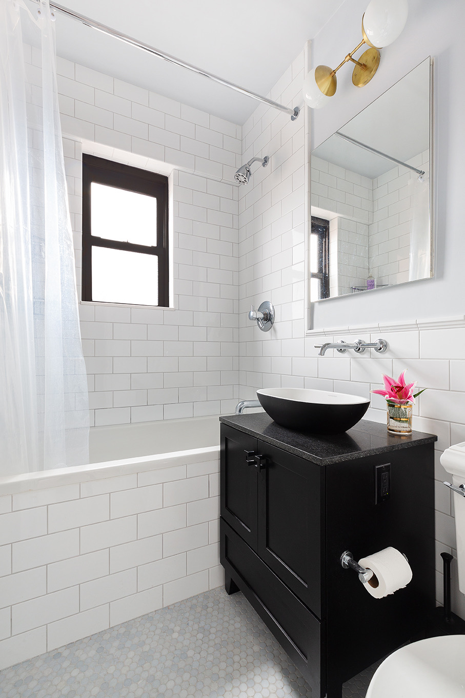 200 East 27th Street, Unit 19C Manhattan, NY 10016 - Photo 6 of 8 a bathroom with a sink and a mirror