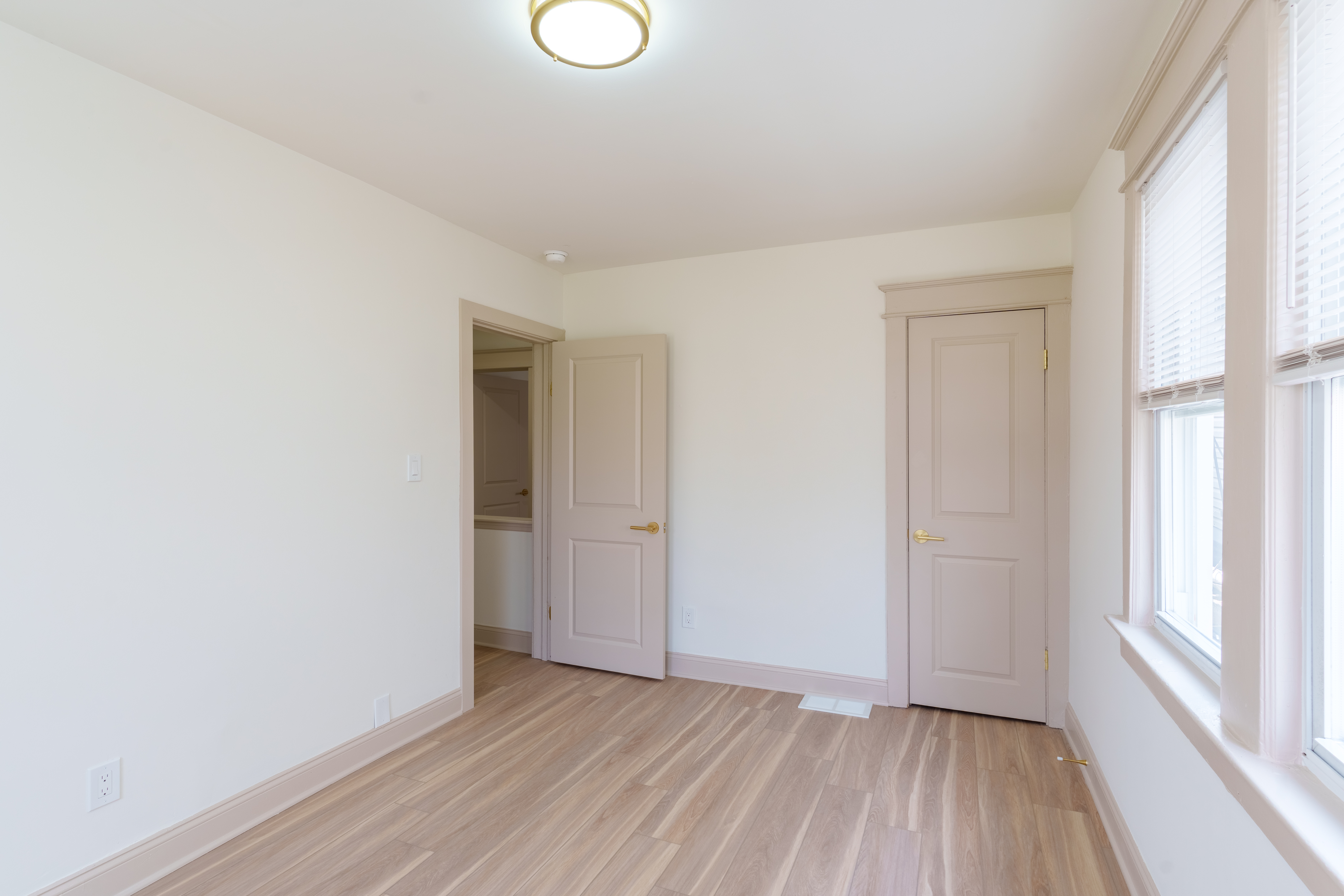 415 North Haddon Avenue Haddonfield, NJ 08033 - Photo 12 of 23 a view of an empty room with wooden floor and a window