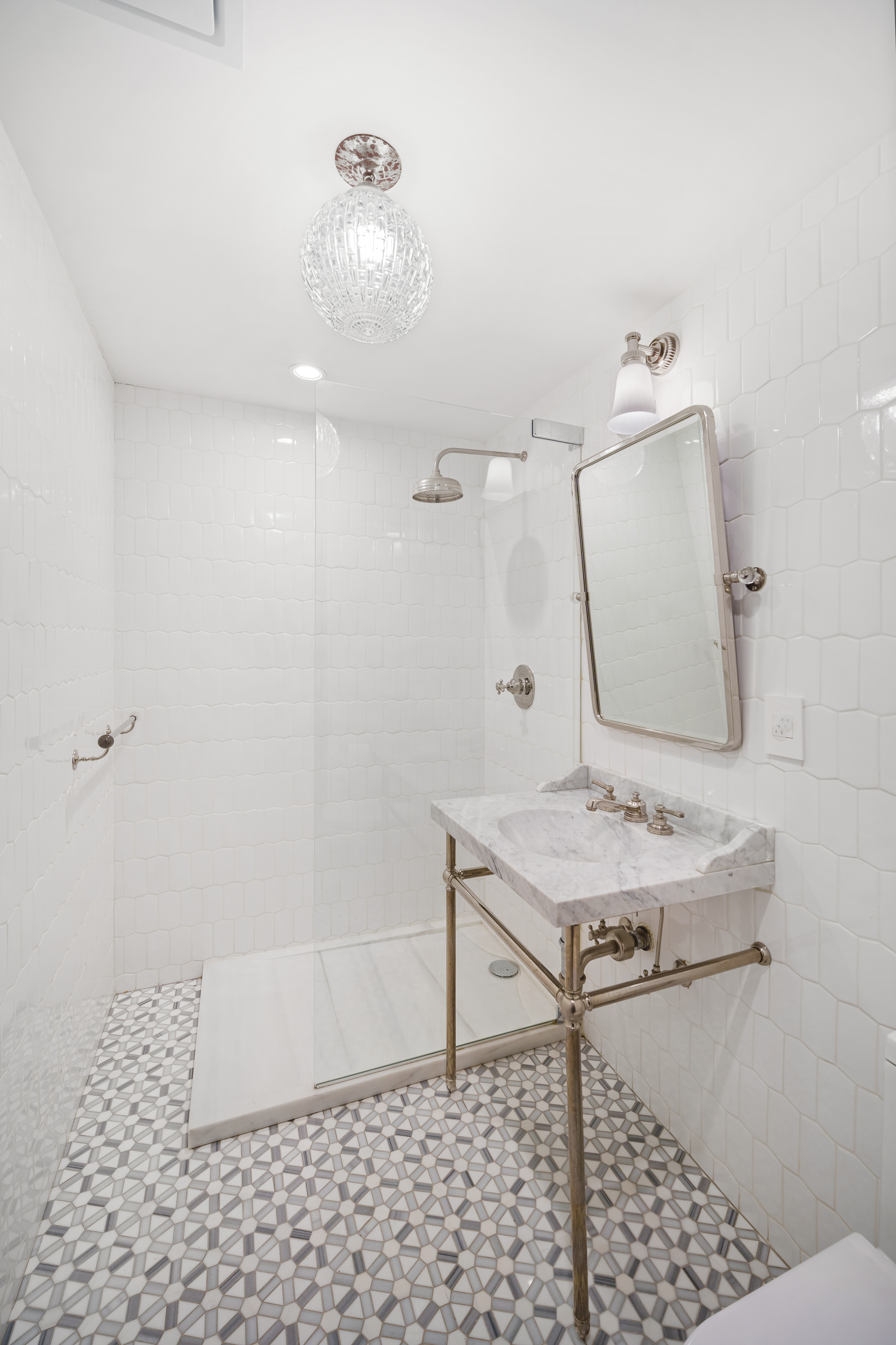 265 6th Avenue Brooklyn, NY 11215 - Photo 17 of 24 a bathroom with a sink toilet and shower