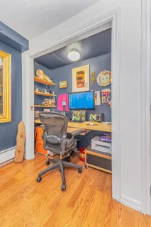 a bedroom with a bed and a lamp on the table