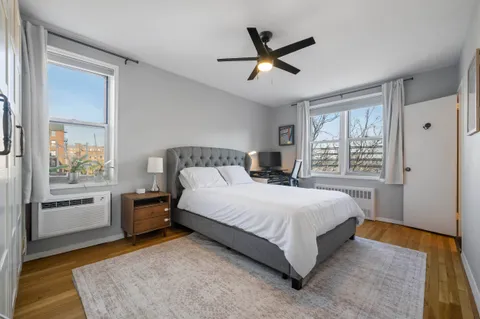 a bedroom with a large bed and a window