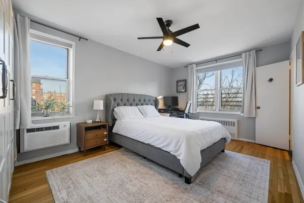 a bedroom with a large bed and a window