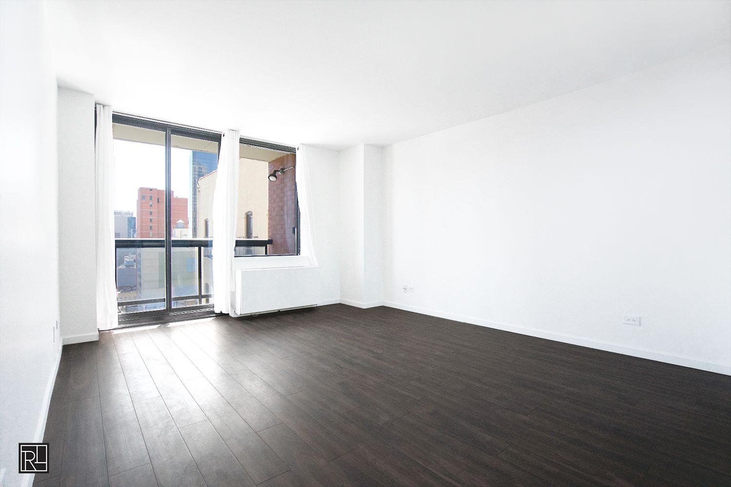 300 East 62nd Street, Unit 1405 Manhattan, NY 10065 - Photo 2 of 10 an empty room with wooden floor and windows