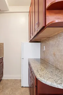 a kitchen with a sink and a refrigerator